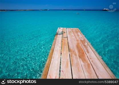 Formentera Ses Illetes beach pier Illetas with Ibiza background at balearic islands