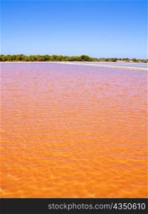 Formentera Ses Salines saltworks red orange water lakes with ripple waves