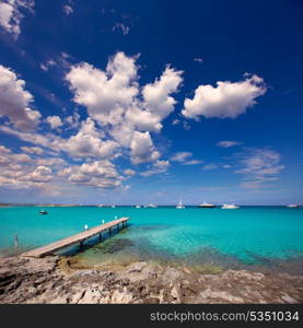 Formentera tropical Mediterranean sea wooden pier in Illetes beach Balearic Islands