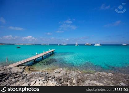 Formentera tropical Mediterranean sea wooden pier in Illetes beach Balearic Islands