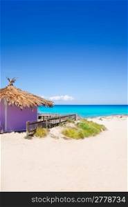 Formentera tropical purple hut on turquoise white sand beach
