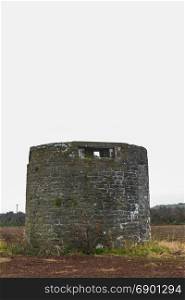 Former windmill with loopholes for anti-invasion defence. Angle, Pembrokeshire, Wales, United Kingdom.