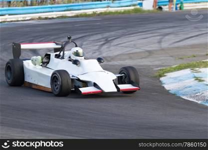 Formula three race car on a speed track
