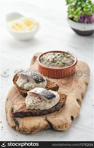 Forshmak - traditional Jewish cuisine. Sandwich with minced herring fillets with apple, onion and egg