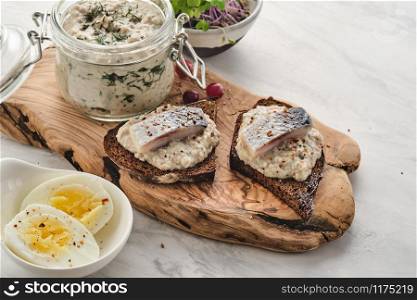 Forshmak - traditional Jewish cuisine. Sandwich with minced herring fillets with apple, onion and egg