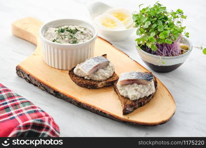 Forshmak - traditional Jewish cuisine. Sandwich with minced herring fillets with apple, onion and egg