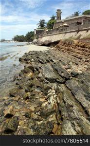 Fort and rocks on the beach in Pampatar, Venezuela
