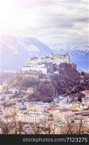 Fortress Hohensalzburg with snowy mountains in the background, autumn time