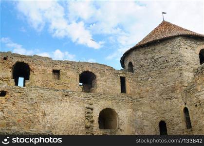 Fortress tower with tiled roof on blue sky background. Location place Ukraine, Europe. Explore the world&rsquo;s beauty.