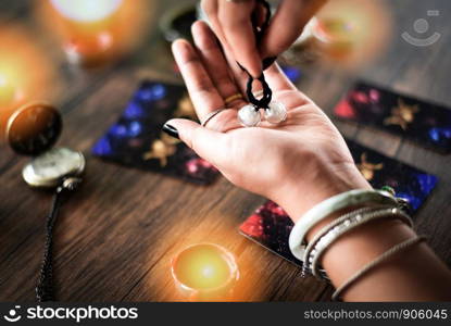 Fortune teller reading fortune lines on hand Palmistry Psychic readings and clairvoyance hands concept with Tarot cards divination