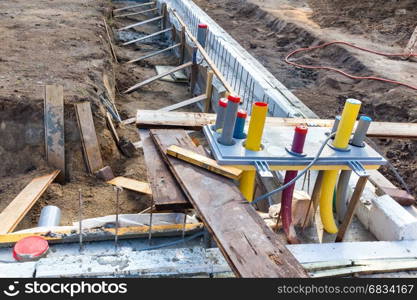 Foundation with pipes on construction site of new house