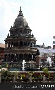 Fountain and temple on the Durbar square in Patan, Nepal