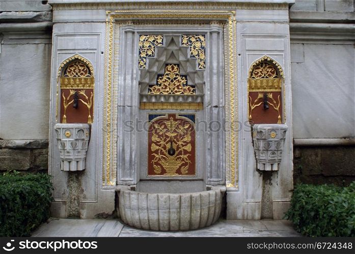 Fountain and wall in Topkapi palace in Istanbul, Turkey