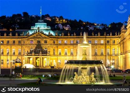 Fountain at neues Schloss New palace in Stuttgart city center, Germany at dusk