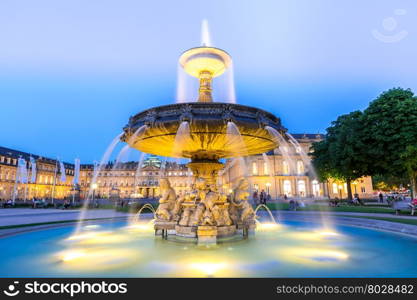 Fountain at neues Schloss New palace in Stuttgart city center, Germany at dusk