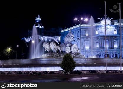 Fountain in front of a palace lit up at night, Cibeles Fountain, Palacio de Linares, Plaza de Cibeles, Madrid, Spain