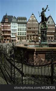 Fountain in front of buildings, Romerbeg Square, Frankfurt, Germany