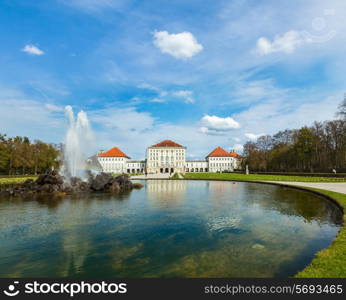 Fountain in Grand Parterre Baroque garden and the rear view of the Nymphenburg Palace. Munich, Bavaria, Germany