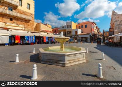 Fountain on the square Platia Eleftheriou Venizelou in the medieval city in the sunny morning, Chania, Crete, Greece. Old town of Chania, Crete, Greece