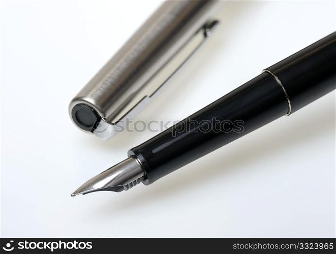 Fountain pen in black on a white background