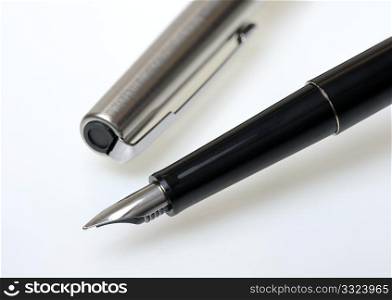 Fountain pen in black on a white background