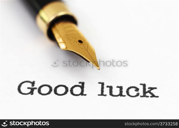 Fountain pen on good luck text