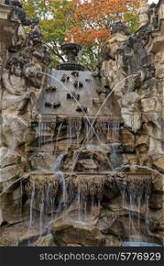 Fountain with faunus statues and streaming water at Zwinger palace, Dresden, Germany&#xA;