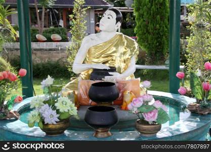 Fountain with white statue monk, Mae Hong Son, Thailand