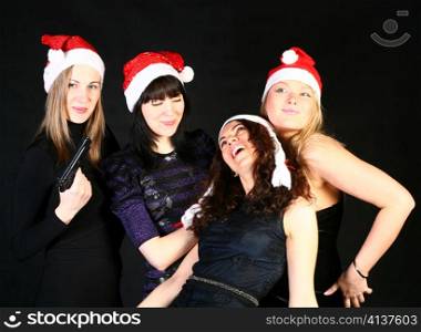four 20-25 years women friends having fun on a christmas party
