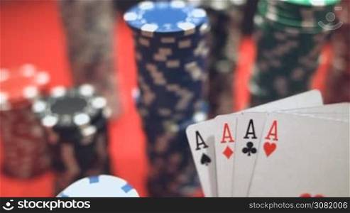 Four Aces On Poker Chips. Poker Table With Chips In Casino