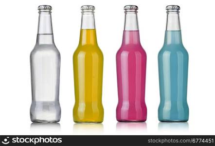 Four assorted soda bottles, non-alcoholic drinks isolated on white
