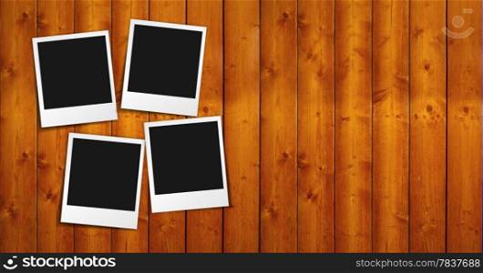 Four blank photo frames with shadow and empty space for your photograph, picture and copy on brown wooden grunge brown background.