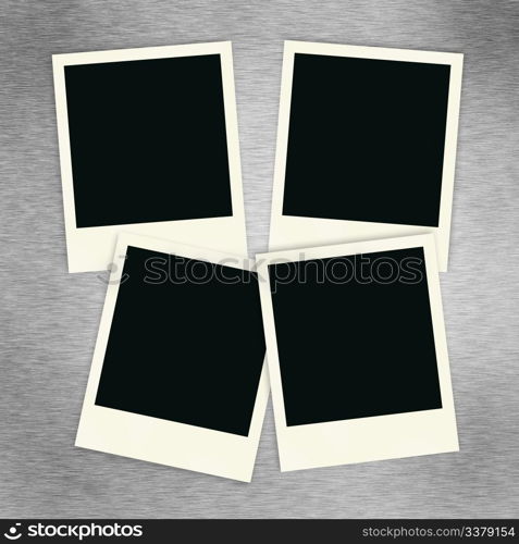 Four blank polaroid images on a brush aluminum background.