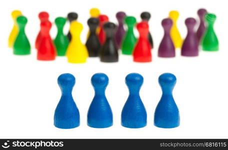 Four blue pawns in front of a large group of different colored pawns