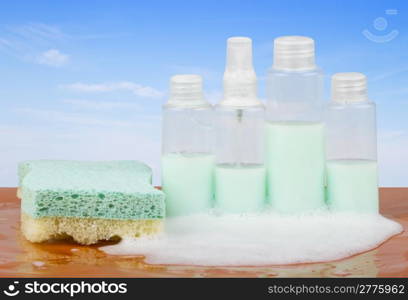 Four bottles of soap with bubbles and sponge