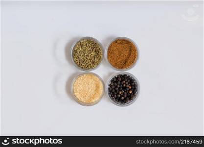 four bowls with spices