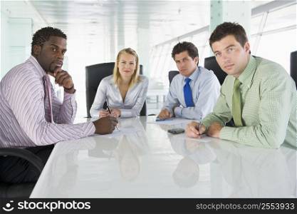 Four businesspeople in a boardroom