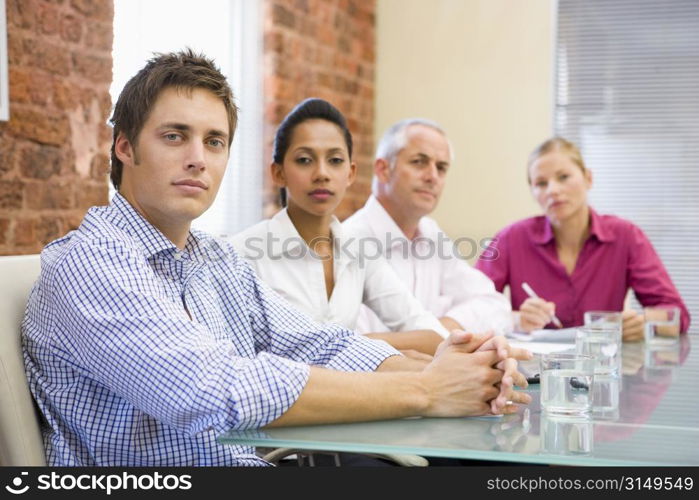 Four businesspeople in boardroom