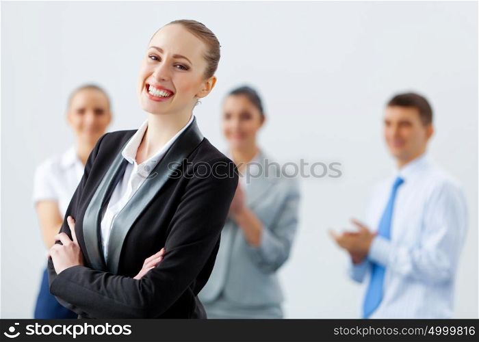 Four businesswomen standing in row. Image of four pretty young businesswomen standing in row