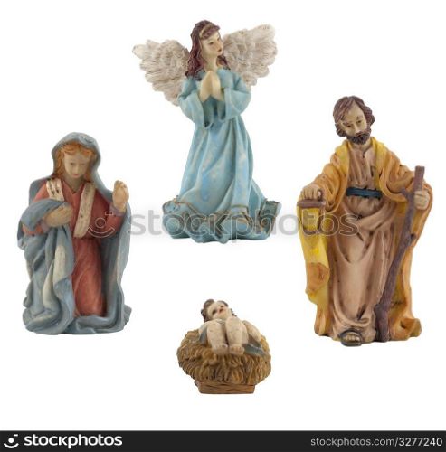 Four ceramic isolated on white statuettes representing Jesus, Mary, Joseph and the Angel