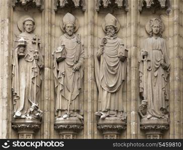 Four christian statues outside the cathedral of Our Lady in Antwerpen, Belgium&#xA;