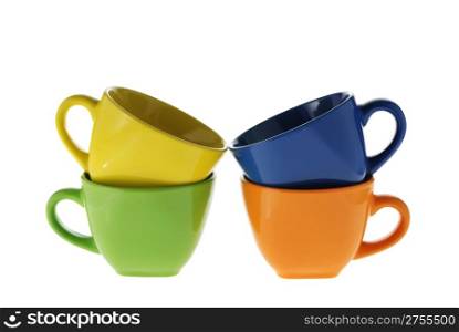 four color cups. Ceramic service from color cups