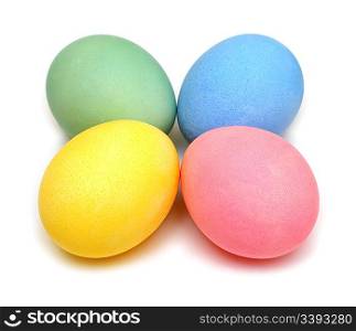 four colored easter eggs isolated on white