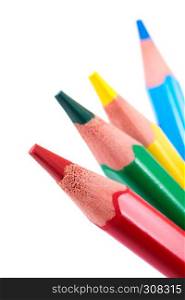 Four colored pencils, red, green, yellow and cyan, close-up shot, isolated on white background . Group of colored pencils