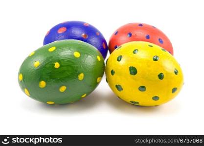 four colorful easter eggs on white background