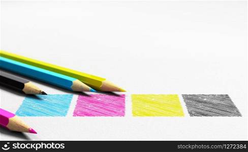 Four colors cian magenta yellow and black handwritten on a paper texture with 4 wooden pencils sourounding it . Concept image for graphic design and prepress.. CMYK