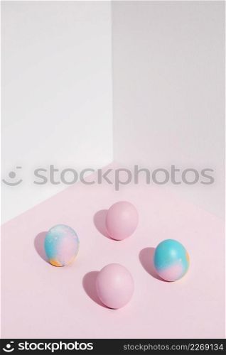 four easter eggs scattered table
