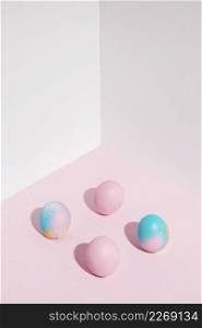 four easter eggs scattered table