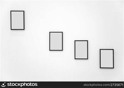 Four frames on white wall