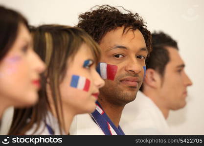 Four French sports fans stood in anticipation